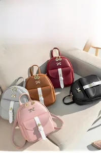 Mini backpacks display in five colors featuring golden bow hardware and contrast pockets