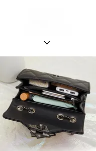 Detail showing internal compartments of quilted crossbody bag with daily essentials
