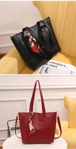 Detail view of large tote bags with decorative silk scarves in black and burgundy tones