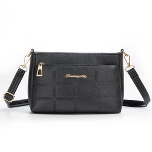 Women's black embossed leather crossbody bag with gold logo and adjustable strap