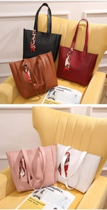 Five elegant leather tote bags in various colors decorated with stylish silk scarves