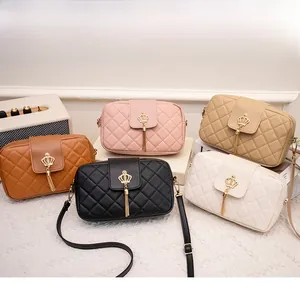 Group shot of diamond quilted crossbody bags with crown buckle and tassel charm details
