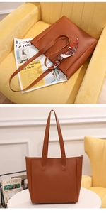 Detailed view of caramel PU leather tote bag with vintage scarf and dual shoulder straps