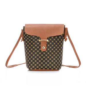 Vintage quilted bucket bag with geometric print and adjustable crossbody strap