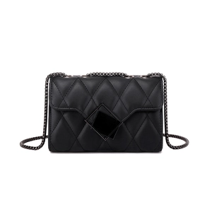 Classic black quilted chain shoulder bag with geometric metal lock on white background
