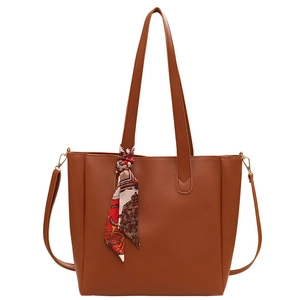 Caramel brown leather tote bag with printed silk scarf detail and slim shoulder strap