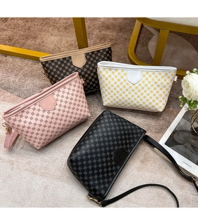Flat lay of four stylish contrast color crossbody bags with vintage patterns and gold zippers