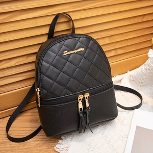 Chic black quilted backpack for women featuring stylish tassels and gold hardware