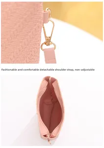 Pink embossed bucket bag detail with detachable shoulder strap and gold hardware