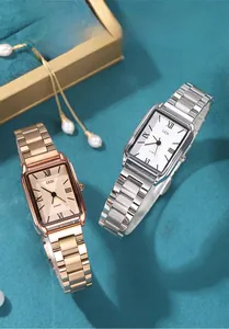 Macro detail of rectangle quartz watches with Roman numeral dials and metal link bracelets