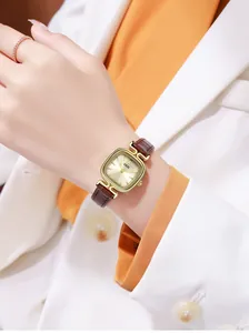 Detail of GEDI vintage square watch with sunray dial and brown leather strap on wrist