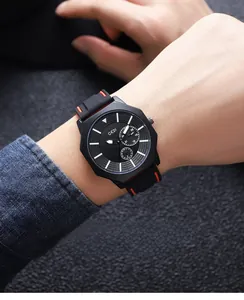 Close-up of GEDI octagonal matte black watch with luminous dial and red-stitched rubber strap