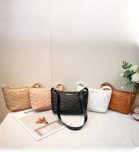 Physical display of wave-pattern quilted crossbody bags in five stylish assorted colors