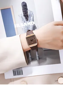 Detailed view of women's GEDI watch with brown silicone strap and square coffee dial
