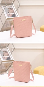 Detailed close-up of pink bucket bag featuring woven texture and gold metal hardware