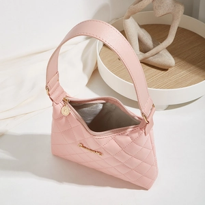 Pink quilted shoulder bag with gold hardware and elegant diamond pattern texture