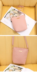 Detailed view of pink woven texture crossbody bucket bag with golden metal accent plate