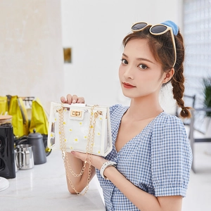 Transparent daisy PVC crossbody bag with white floral prints and gold chain strap