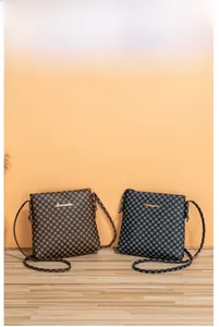 Detail of casual crossbody bags with grid pattern in brown and blue-grey with metal logo