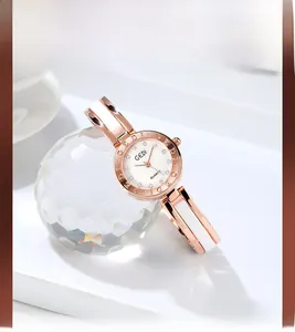 Elegant rose gold quartz watch on crystal decor with white pearl dial and crystal markers