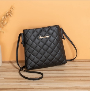 Detailed view of black quilted PU leather crossbody bag with gold Sunnyway logo