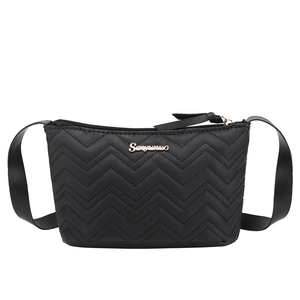 Chic black quilted shoulder bag with V-shaped stitching and metallic logo detailing