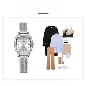 Macro detail of silver square quartz watch with stainless steel Milanese mesh strap