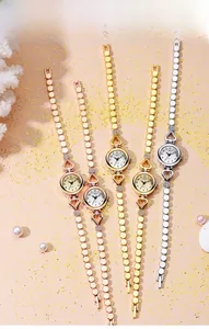 Group of luxury women bracelet watches in rose gold, gold and silver on pastel background