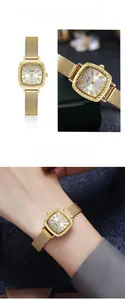 Detail of GEDI vintage gold mesh strap watch with Roman numeral square dial on wrist