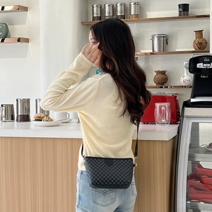 Casual shell crossbody bag with grey checkerboard pattern and black shoulder strap