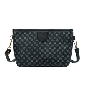 Fashionable black crossbody bag with grey clover pattern and adjustable strap