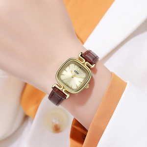 Vintage gold square watch for women with brown leather strap on model wrist