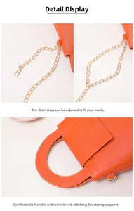 Détail du sac à main orange en similicuir avec bandoulière chaîne et poignée renforcée