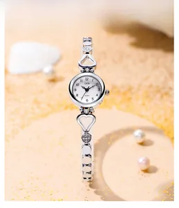 Close-up of GEDI women's quartz watch with heart-shaped hollow band and crystal accents
