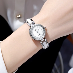 GEDI elegant women's quartz watch featuring silver metal and white ceramic strap