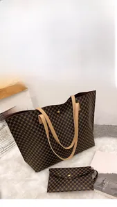 Close-up of vintage printed tote bag set with a matching pouch on white faux fur