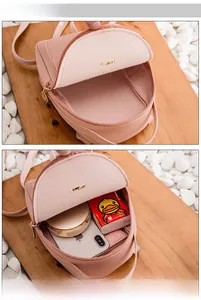 Pink mini backpack capacity display showing space for phone and makeup essentials