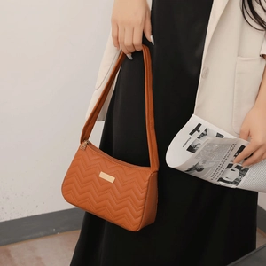 Brown quilted faux leather underarm shoulder bag for women with golden metal detail
