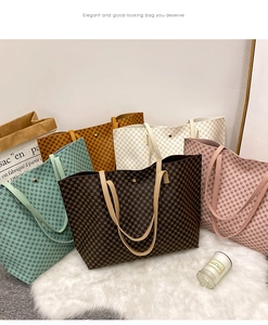Detail shot of versatile tote bags in five colors with geometric prints on plush rug