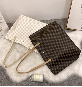 Detail view of printed tote bags with geometric floral patterns on white faux fur carpet