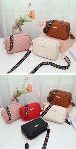 Close-up of quilted crossbody bags in five colors with LOVE lettered woven straps