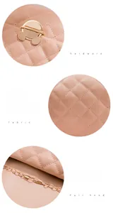 Detail of pink quilted leather bag showing gold tiger lock and metallic chain strap