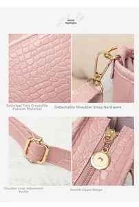 Detalle de bolso tipo cubo rosa efecto cocodrilo con herrajes dorados y correa ajustable