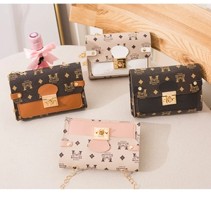 Detailed view of four colorful chain shoulder bags with classic monogram and gold locks
