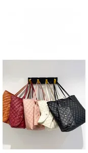 Detailed display of quilted tote bags in black, beige, pink, burgundy and brown colors