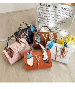 Quilted small square handbags in five colors with V-logo metal hardware and tassel detail