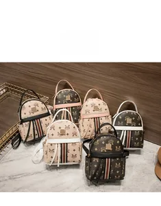 Detailed view of mini PU leather backpacks featuring letter monogram prints in various colors