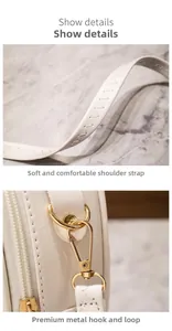 Detail of wide soft ivory leather strap and golden swivel spring hook on handbags