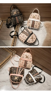 Detail of mini printed backpacks with gold hardware and red-green striped webbing