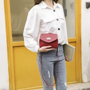 Elegant red crocodile pattern square bag with gold twist lock and pearl handle
